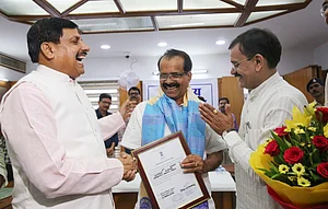 PTI : Union Minister George Kurian (C) |